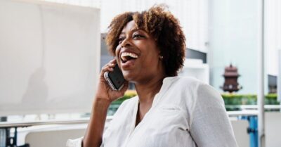woman talking on the phone smiling