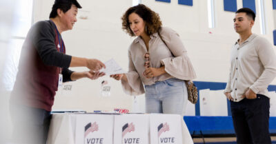 woman voting at the polls