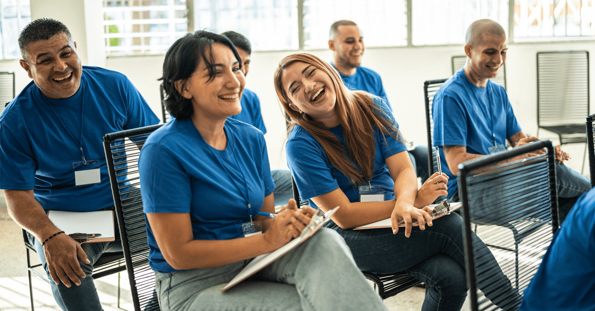 Campaign volunteers laugh and smile at a volunteer engagement event.