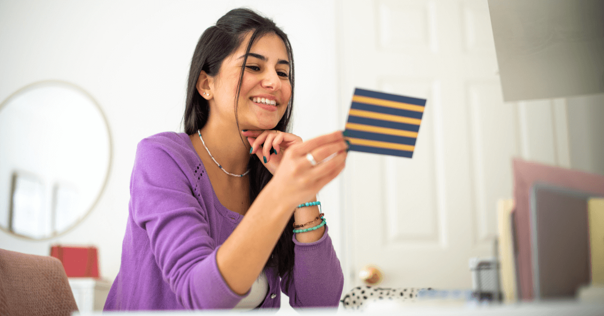 Someone reading a thank-you letter for donations at home.