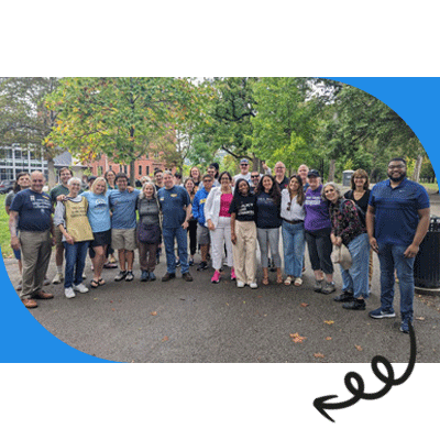 Lindsay Powell stands with dozens of volunteers heading out to knock doors. 