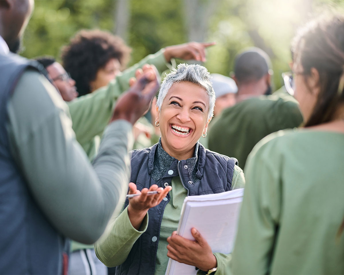 Volunteer signing supporters up for a community campaign event.