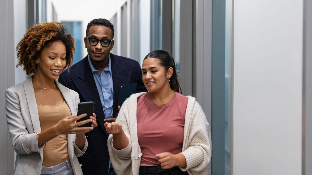 Campaign team discussing field strategy inside a community workspace.
