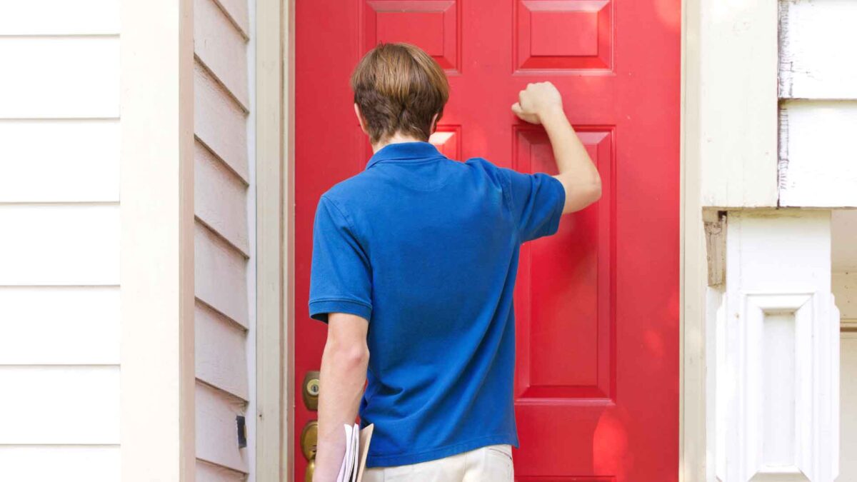 PAC supporter or volunteer confidently knocking on a door during voter outreach