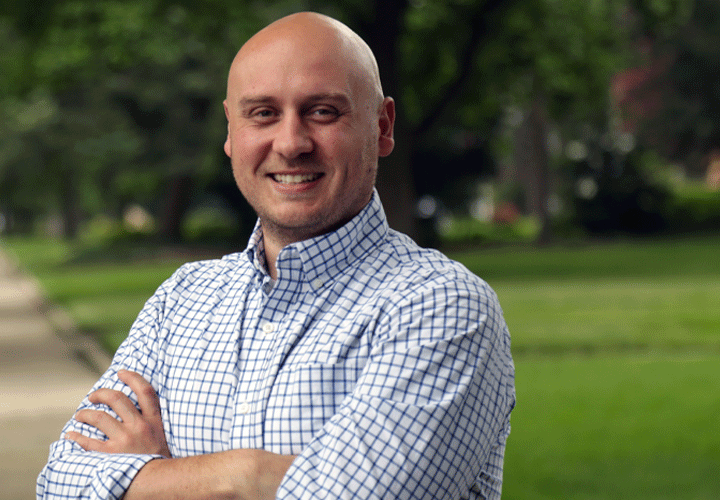 Indiana State Representative Kyle Miller standing on a sidewalk in a neighborhood