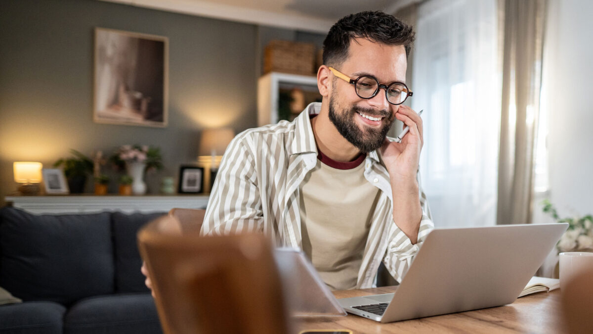 A person setting up their call time program on their laptop at home