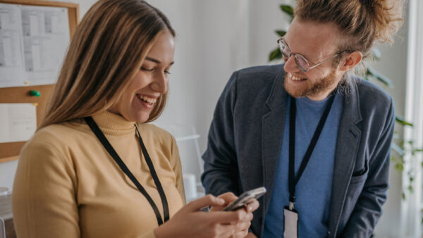 Two organizers looking at their phone using VPB Connect
