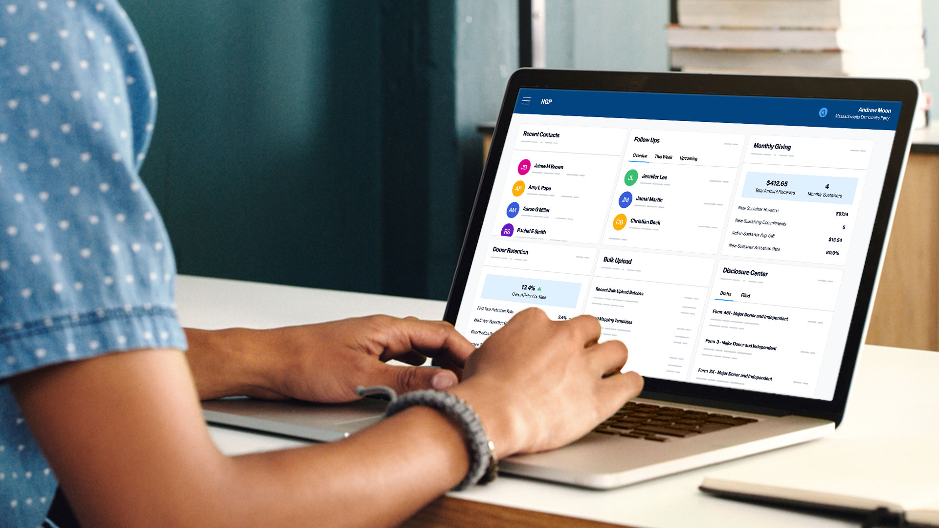 Person working on their laptop within the NGP platform looking at a fundraising dashboard.
