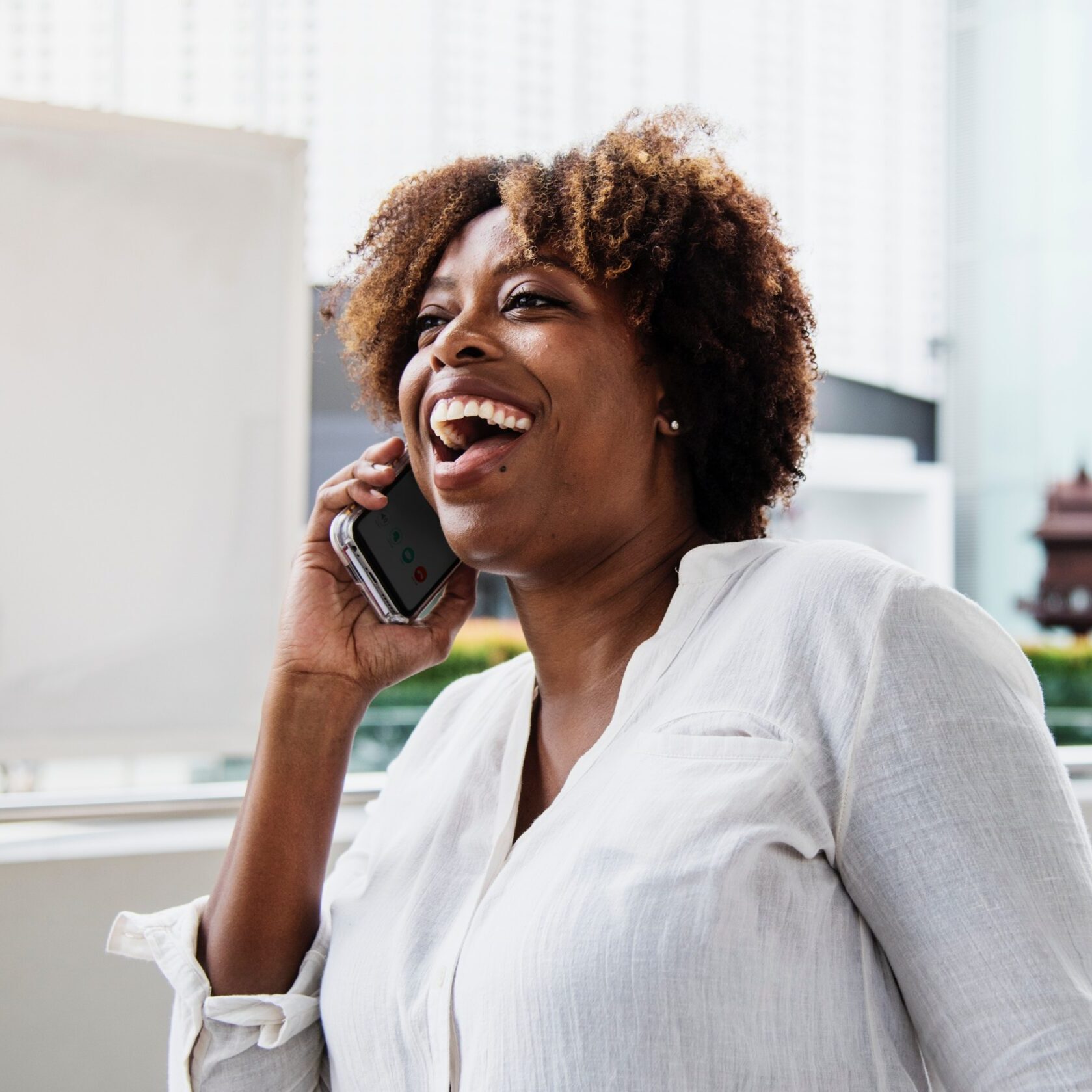 woman talking on the phone smiling