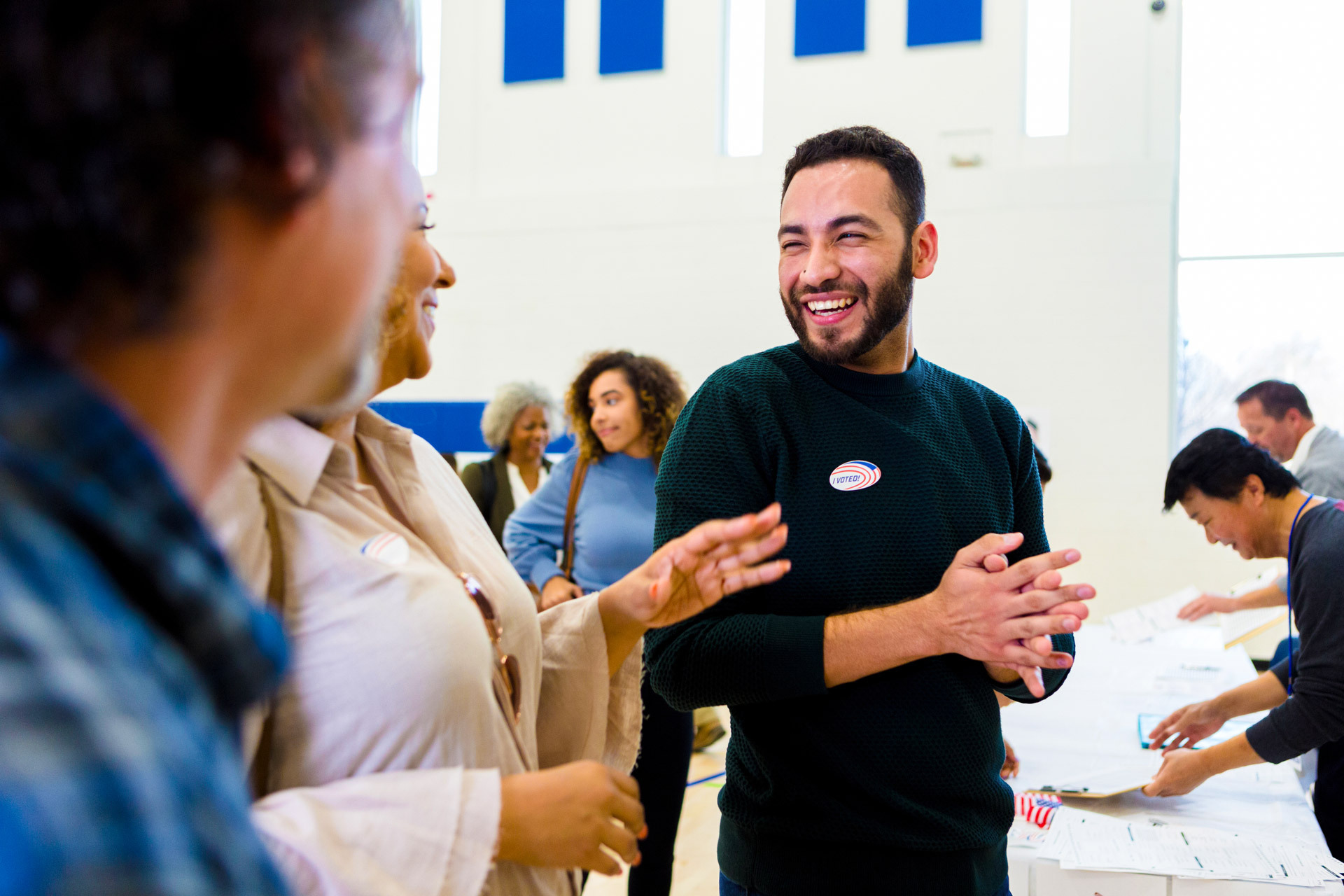 Voter smiling after casting ballot for local election.